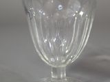 a glass cup that is sitting on a table