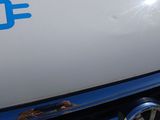 a close up of a volkswagen logo on the front of a car