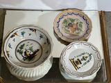 three bowls and a bowl sitting on a tray