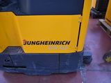 a yellow and black machine that is sitting on the floor