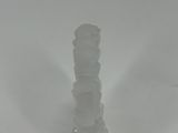 a glass candle holder that is sitting on a table