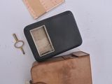 a wallet and a cell phone sitting on top of each other