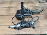 two electric tools sitting on a wooden table
