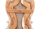 a wooden clock that is on display on a white surface