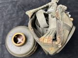 a small bag with a gas can inside of it on a table