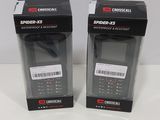 pair of black cell phones sitting in a box on a white surface