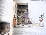 un livre ouvert sur lequel figure l'image d'un homme et d'une femme dans une cabane