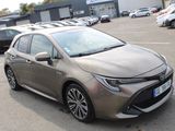 the toyota corollant is parked in a parking lot