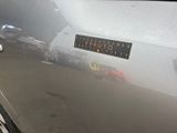a close up of a car door with a sticker on it