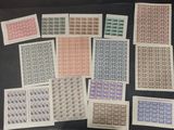 a table topped with lots of different types of stamps on top of each other