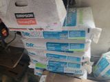 a pile of boxes sitting on the floor in a room
