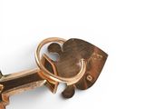 a gold key that is attached to a key holder