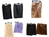 several different colored skirts hanging on a clothes rack