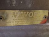 a close up of a metal sign on a metal surface