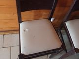 two chairs sitting next to each other on a tiled floor