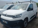 a white van that is parked in a parking lot