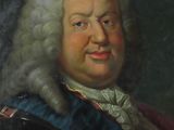 portrait of a man in armor with a white wig and a blue jacket
