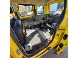a picture of a yellow truck with the door open
