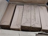 many boxes of pizza sitting in a box on the floor