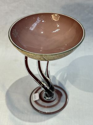 a small table with a glass bowl on top of it