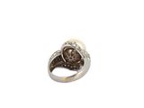 an image of a silver ring with a brown stone in the center