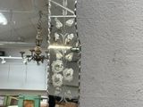 a large mirror hanging on the wall in a room
