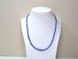 necklace made of blue beads on a white mannequin