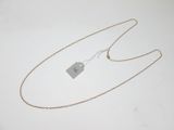 a close up of a necklace with a tag attached to it