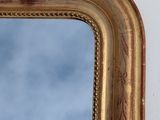 a gold frame with a blue sky in the background