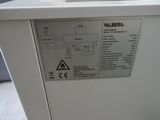 a label on the side of a machine that is sitting on the floor
