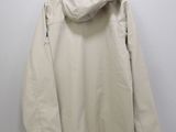 an image of a jacket hanging on a hanger on a wall
