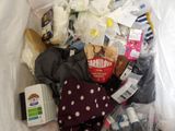 a plastic bag full of baby items and diapers