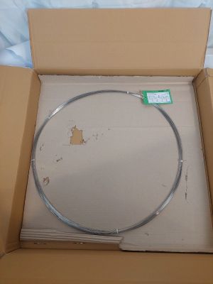 a cardboard box with a round object inside of it