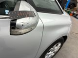 a car with a sticker on the side of it ' s door