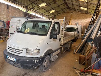 a man standing next to a truck in a garage