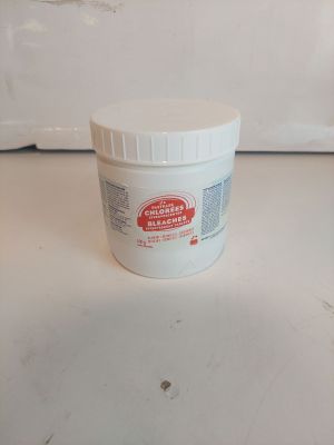 a jar of toothpaste sitting on a counter