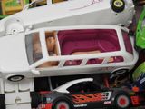a toy car that is sitting on top of a toy truck