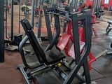 a large gym with a lot of machines in it