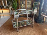 a small metal cart that is sitting in a room