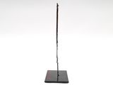 an image of a statue of a man holding a sword on top of a black base