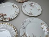 many plates that are sitting on a table