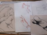 sketches of a woman ' s face, hands, and feet on a table