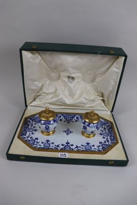 an image of a blue and white tray with two candles in it