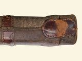 an old leather case with a brown leather handle