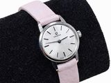 an image of a woman ' s wrist watch with a pink leather band