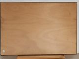 a picture of a painting on a easel in a room