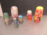 a lot of different colored russian nesting dolls on a table
