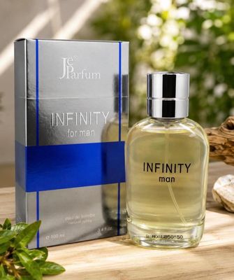 un flacon de parfum posé sur une table, à côté d'une boîte