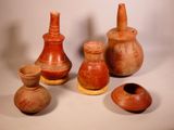 a group of vases that are sitting on a table