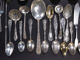 many spoons and spoon spoons on a black surface